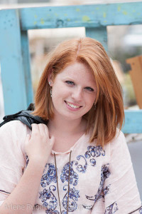 Senior portraits with pastel blue window frame in background